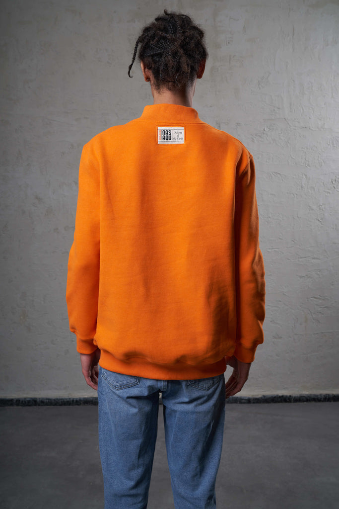 back of an orange color man sweat made ethically
