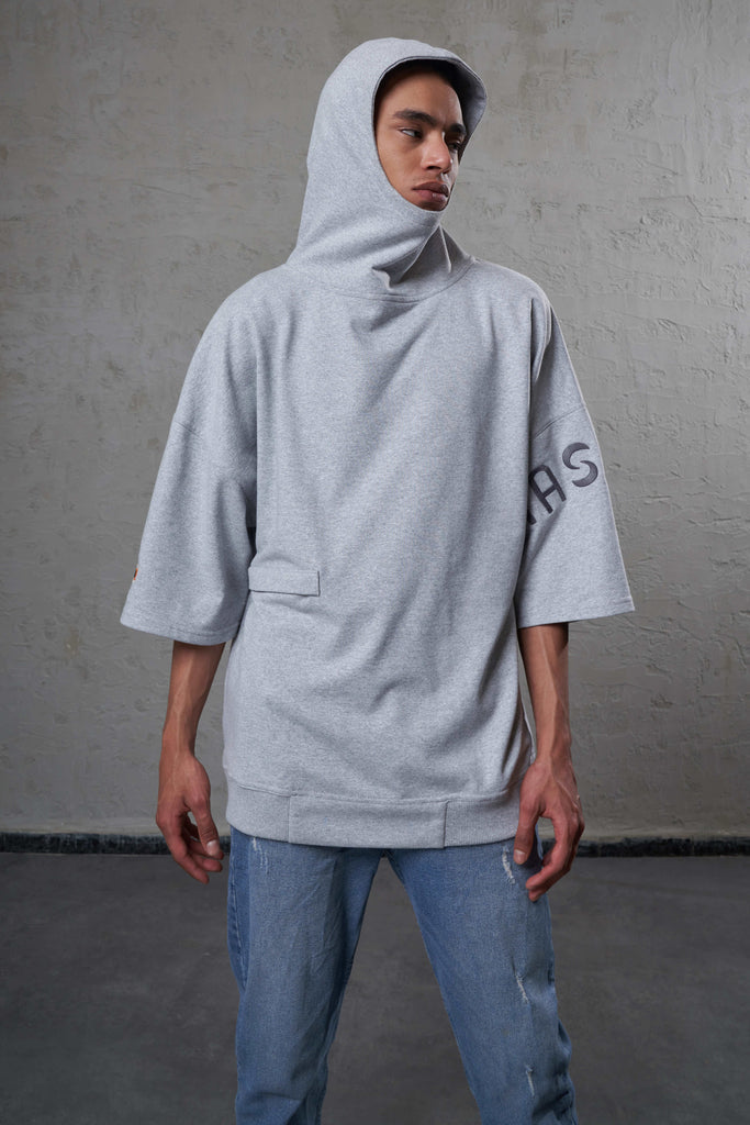 young man wearing a gender free hoodie made with sustainable cotton