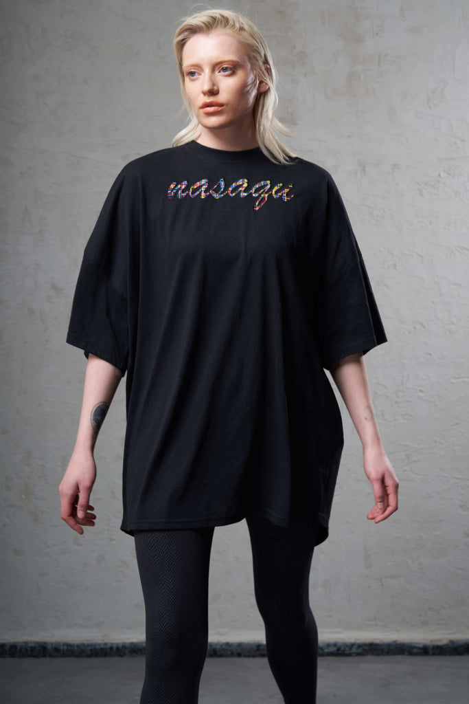 girl wearing a super oversized black t-shirt made with sustainable cotton and ethical production