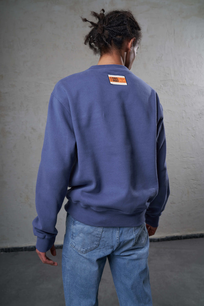 back of blue crewneck made with ethical practices