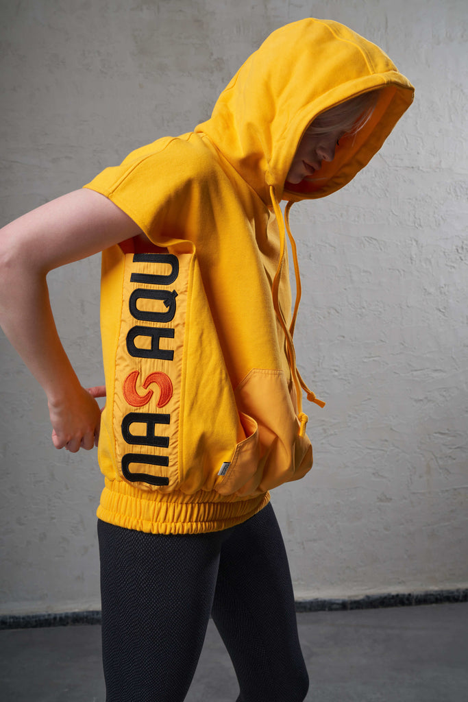 sustainable yellow hooded top made with eco-friendly cotton fabric