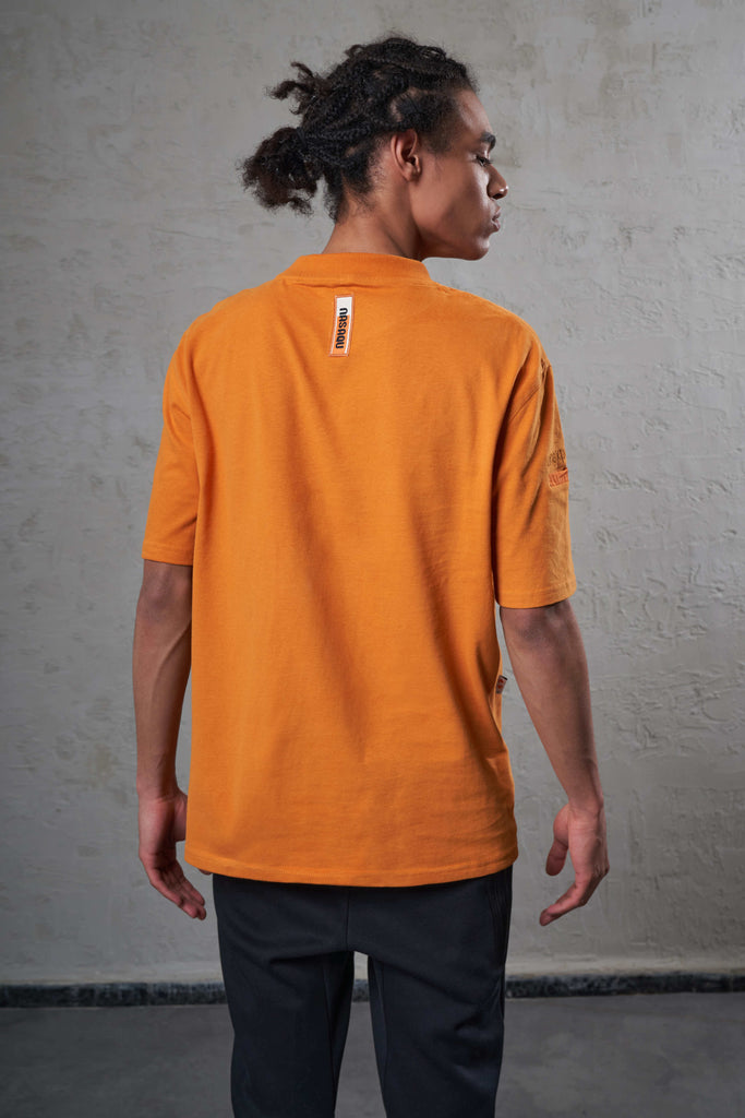 back of an orange ethically made man t-shirt