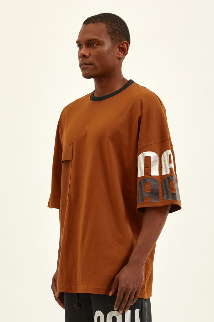 kandy brown t-shirt with an amazing embroidery on a single arm
